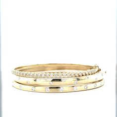 Our Round Edge Scatter Diamond Bangle is beautiful. We set Diamonds throughout this Solid Gold Round Edge Bangle. The perfect piece to add a little sparkle to any wardrobe! 14k Yellow Gold Solid Gold .25ctw Diamonds 6.5" in diameter Box and tongue with safety clasp LS Collection Stackable Diamond Gold Bracelet, Formal Stackable Round Diamond Bracelet, Formal Round Stackable Diamond Bracelet, Diamond Bangle, Jewelry Stores, My Jewellery, Solid Gold, Bangles, Diamonds