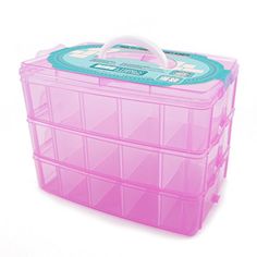 a pink plastic storage box filled with lots of drawers on top of a white surface