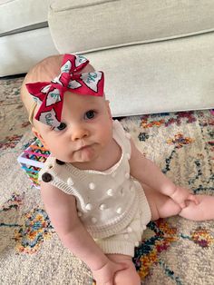 Our classic hand tied bow is made from 100% cotton.  It measures approximately 3.5" across.  The bow can be attached to either a tan nylon headband OR an alligator clip! Can also be tied onto a hair tie! Moms love our one-size nylon headbands because they can't be outgrown and don't leave marks only baby's head. They are extremely soft and stretchy and fit newborns through adults. The alligator clips are reversible so they can be worn on either side of the head! These beautiful top knot headband Cute White Headband With Pink Bow, Playful White Bow With Matching Headband, Cute White Bow With Matching Headband, Cute White Headband With Bow Tie, Ohio State Baby, Football Headband, Osu Football, Top Knot Headbands, Baby Bow