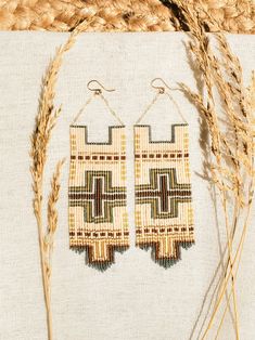 Experience the allure of a picturesque Southwest sunset with the Isla Beaded Earrings. Carefully handwoven using Delica seed beads, these earrings feature an intricate blend of warm terracotta, sandy beige, and golden hues reminiscent of adobe clay walls basked in the setting sun. With a perfect balance of elegance and rustic charm, these earrings add a touch of Southwestern elegance to any ensemble, making them an ideal choice for those seeking unique and artisanal jewelry. Handmade beaded earr Delica Seed Bead Earrings, Brown Woven Bohemian Jewelry, Bohemian Brown Woven Jewelry, Traditional Handwoven Gold Beaded Earrings, Traditional Gold Handwoven Beaded Earrings, Handmade Southwestern Gold Earrings, Artisan Woven Gold Jewelry, Artisan Gold Woven Jewelry, Artisan Gold Handwoven Earrings