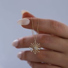 Diamond & 14K Solid Gold Starburst Necklace: This stunning 14K solid gold starburst pendant with your choice of genuine diamond or cubic zirconium stone is a symbol of guidance, protection, inspiration and hope. Bold enough to make a statement on its own, and minimal enough to be layered with other pieces, this necklace will glow brightly and help serve as a reminder that there is meaning and purpose behind every destination.  Materials & Specifications:  - 14K solid gold chain and pendant - Genuine diamond or cubic zirconium stone  - Chain thickness is 2.5mm - Pendant dimensions are 1.6cm x 1.6cm Available in 5 different chain lengths: 42cm (16.5 in), 45cm (17.7 in), 47cm (18.5 in), 49cm (19.3 in) As with all of our products, this item is handmade and made to order. **WEARING YOUR JEWELRY 3 Diamond Pendant, 14k Gold Starburst Jewelry Gift, 14k Gold Starburst Jewelry As Gift, 14k Gold Starburst Jewelry For Gift, Dainty Starburst Yellow Gold Jewelry, Yellow Gold Starburst Necklace As Gift, Yellow Gold Starburst Necklace For Gift, Starburst Fine Jewelry Necklace As Gift, Starburst Fine Jewelry Necklace For Gift