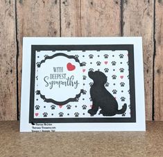 a black and white card with a dog on it's side, saying with deepest sympathy