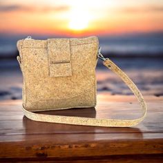 Say hello to our Silver Fleck cork Crossbody bag with a soft silver accented, cork and handmade quality. This is more than just a bag. It's a fashion statement. The zipper and magnetic snap closure keeps your essential secure, while the inside zipper pocket insures you stay organized on the go,and best part ? It's  trendy, functional, and stylish too . 9 1/2 inches tall 9 inches wide 3 1/2 inches deep magnetic snap and zipper closure adjustable, removable strap inside zipper pocket Cork is impermeable, buoyant ,elastic ,fire retardant and waterproof . Cork is a natural material who's applications have been around since ancient times . 1600 to 1100 years BC cork was used in footwear most cork today comes from Portugal or Spain and is used for wine bottle stoppers. The cork industry is Gener Cork Purse, Bag Silver, Wine Bottle Stoppers, Fire Retardant, Bottle Stoppers, Stay Organized, Silver Accents, Natural Material, Ancient Times