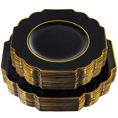 black and gold plates stacked on top of each other