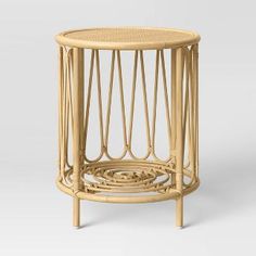 the side table is made out of wicker and has a circular design on it