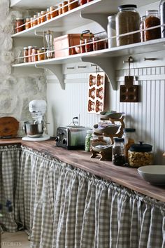 the kitchen counter is lined with dishes and utensils