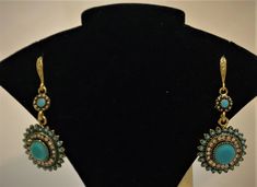 Dangling Costume Jewelry earrings in unconventional styles and beautiful stones. The stone colors are Ruby Red, Turquoise Green, Onyx Black, Emerald Green, and Sapphire Blue. Available in silver or gold covered medal. Turquoise Gemstone Earrings For Party, Turquoise Jewelry For Party, Turquoise Jeweled Jewelry For Gift, Turquoise Costume Jewelry Earrings For Gift, Beautiful Stones, Costume Jewelry Earrings, Red Turquoise, Turquoise Green, Dangling Earrings