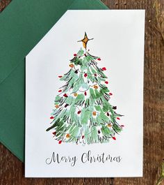 a card with a christmas tree on it