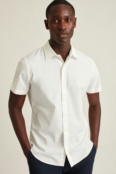 Stretch Riviera Short Sleeve Shirt | Bonobos Modern Cotton Tops For Semi-formal Occasions, Semi-formal Fitted Top With Collared Neckline, Slim Fit Shirt With Button Closure For Summer, Relaxed Fit Collared Shirt With Button Closure, Classic Summer Shirt With Fold Down Collar, Classic Button-up Shirt With Back Button Closure, Summer Shirt With Placket And Fold Down Collar, Solid Dress Shirt With Spread Collar For Spring, Summer Shirt With Fold Down Collar And Placket