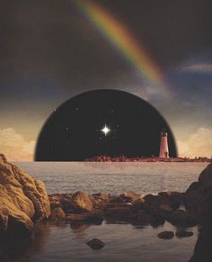 a lighthouse with a rainbow in the sky above it and water on the ground below