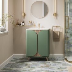 a bathroom with a green cabinet and mirror