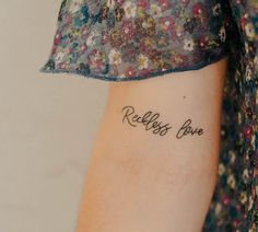 a woman with a tattoo on her arm that reads, relishes for you