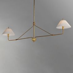 three light brass chandelier with white shades