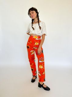 Incredible 1990s sun print jeans by the iconic designer 'Moschino jeans'. These are incredibly rare! Side zip entry Beautiful golden button on the side Moschino jeans logo on the back ꩜Label: Moschino Jeans, made in IT ꩜Condition: great vintage condition, gently worn.  ꩜Material: cotton ꩜Sizing: Fits  Please check measurements provided below. Waist laid flat 35 cm Length 101 cm Rise 28 cm Hip 51 cm  Inseam 74 cm All measurements taken with garment laid flat ꩜All garments shown on a 165 cm tall m 90s Style Cotton Summer Pants, Retro Graphic Print Bottoms For Spring, Retro Spring Bottoms With Graphic Print, Retro Graphic Print Spring Bottoms, Retro Jeans With Graphic Print For Spring, Retro High Waist Bottoms With Graphic Print, Summer Graphic Print Fitted Jeans, Summer Fitted Jeans With Graphic Print, Fitted Graphic Print Jeans For Summer