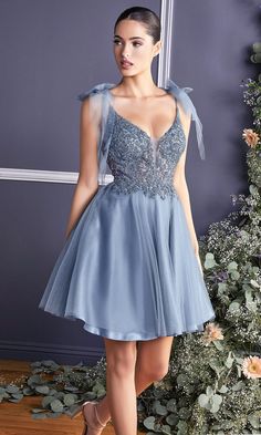 Sweet and sparkly, this short homecoming dress has sheer tulle shoulder bows that offer an adorable look for your semi-formal event. With a shimmering sequin bodice, this short party dress has a sheer inset at the plunging v-neckline and bowed shoulder straps that lead to the deep v-back. The short a-line dance dress has a fully-lined short skirt with a sheer tulle overlay that makes it a figure-flattering choice for homecoming, sweet-16 parties, and other fancy dances. Affordably priced under $ Prom Tulle Mini Dress For Party Season, Mini Length Tulle Evening Dress For Prom, Summer Prom Dress In Glitter Tulle, Tulle Evening Dress For Homecoming Party, Elegant Homecoming Dress In Glitter Tulle, Glitter Tulle Dress With Sweetheart Neckline For Homecoming, Short Tulle Skirt, Tulle Dress Short, Tulle Cocktail Dress