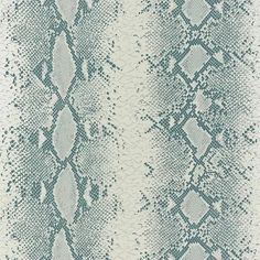 a blue and white snake skin pattern on fabric