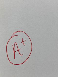 the letter a is drawn in red ink on white paper with a circle at the bottom