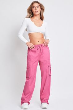 It’s giving utility but make it cute! Get things done in our Women’s Mid-Rise Cargo Pants – these pull-on trousers are so good, you’ll never want to pull them off. Designed to be comfortable with a still-flattering silhouette, this mid-waist pant features a hint of stretch and a straight leg. Detailed with a drawstring hem for option to wear open or tied for a cinched ankle. Pair with a cropped tank and sneakers for a fun sporty vibe. Product Details:- Mid-Rise- Elasticized Waistband with Drawstring- 4 Pocket Construction- Front Slant Pockets- Flap Cargo Pockets at Sides- Drawstring Straight Leg Hem- Relaxed Fit- Full Length Size & Fit (based on size M)- Inseam: 31”- Rise: 12”- Leg Opening: 21”- Model is wearing a size SMachine wash cold. Separately inside out. Tumble dry low.98% Cotton/ 2 Pink Utility Wide Leg Parachute Pants, Pink Wide Leg Utility Parachute Pants, Spring Utility Cargo Pants For Loungewear, Utility Cargo Pants For Spring Loungewear, Spring Full-length Cargo Pants For Loungewear, Spring Pink Cargo Pants With Elastic Waistband, Ymi Jeans, Mid Waist Pants, Dress Purse