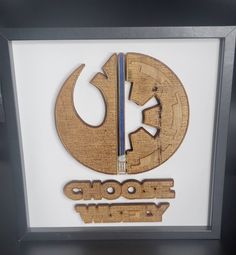 a star wars logo with the word choot weey written in wood cutouts