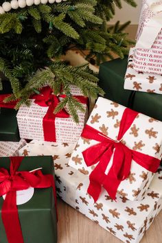 three wrapped presents under a christmas tree