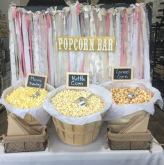 popcorn bar set up with two baskets full of popcorn