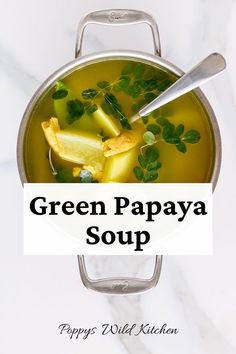 Pot of golden broth soup with green papaya, vegan chicken and moringa leaves. Tinola Soup, Tropical Fruit Recipes, Garlic Broth, Papaya Smoothie, Soy Curls