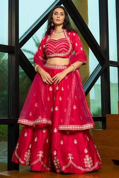 Fashion and style always depends on good color and fantastic combination of shades, so we create best shades to enhance your beauty and personality. Make an adorable statement in this smashy pink art silk lehenga choli. The embroidered work on attire personifies the entire appearance. Comes with matching choli and dupatta. Half Sleeve Blouse Designs, Bengali Wedding Dress, Punjabi Wedding Dress, Western Lehenga, A Line Lehenga, Velvet Suit Design, Western Gowns, Ruby Red Color