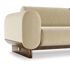 a beige couch with wooden legs on an isolated white background