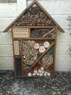 a bird house made out of wood and other items