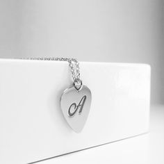 This is the piece of jewelry to get for every Rock lover. This Guitar pick necklace the perfect gift for guitarists ,music lovers, and for every musician. The necklace is totally handmade the base material is 14k or 9k Solid Gold,White or Rose gold Metal information and dimensions details: ---------------- Width : 17.00mm x 14.50mm Metal: Solid 9K Yellow ,White or Rose gold or Solid 14K Yellow ,White or Rose gold Solid gold chain 9k Yellow,White or Rose gold or Solid gold chain 14k Yellow,White Heart-shaped Music-themed Jewelry Gift, Music-themed Heart-shaped Jewelry Gift, Personalized Music-themed Necklaces For Anniversary, Music-themed Pendant Necklaces As Gift, Music-themed Pendant Necklace As Gift, Music-themed Pendant Jewelry For Gifts, Music-themed Pendant Jewelry As Gift, Music-themed Jewelry For Valentine's Day Gift, Music-themed Pendant Jewelry Gift