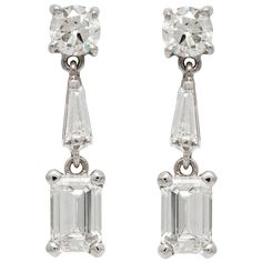 Earrings, finely crafted in platinum with emerald cut diamonds weighing approximately a total of 1.50 carat, round cut diamonds weighing approximately a total of 0.60 carat and baguette cut diamonds weighing approximately a total of 0.20 carat. Circa 1950's. Classic Baguette Diamond Earrings For Formal Occasions, Formal Platinum Diamond Earrings Baguette Cut, Formal Platinum Baguette-cut Earrings, Formal Baguette Cut Platinum Diamond Earrings, Platinum Diamond Earrings With Baguette Diamonds For Formal Events, Formal Platinum Baguette Cut Earrings, Platinum Diamond Earrings With Baguette Diamonds For Formal Occasions, Platinum Diamond Earrings With Baguette Cut For Formal Occasions, Platinum Earrings With Baguette Cut Diamonds