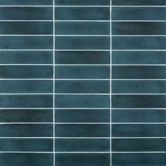 a blue tile wall with white lines on it