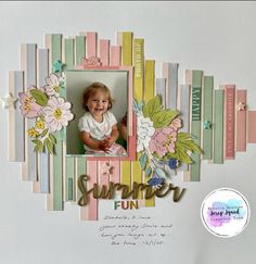 a scrapbook page with an image of a baby in the center and flowers on it