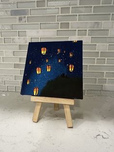 Hand painted 4x4in (10.1x10.1cm) famed mini canvas. Lanterns floating in the night sky with two little cats making a wish.  Hope and whimsy, enjoying the night sky. Perfect for small spaces and desks! Small Canvas Aesthetic Art, Small Painting Canvas Ideas, Mini Paintings Acrylic, Mini Canvas Art Couple, Painting On Small Canvas Ideas, 4×4 Canvas Painting, 4x4 Paintings Ideas, Night Aesthetic Painting