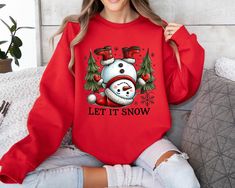 Let it Snow Christmas Snowman Sweatshirt, Christmas Sweatshirt, Snowman Shirt, Snowman T-Shirt,Christmas Crewneck,Christmas Shirts for Women Sizing and Colors: Please refer to the size chart on the listing photos in every listing for a detailed sizing chart with measurements. Since all shirts are made to order, sizing issues will not be refunded. All T-SHIRTS brands are either Bella Canvas or Gildan. How Do I Order 1 - Please review all the information provided before placing an order 2 - Select the shirt type and size using the drop down menu. 3 - Select the color of the shirt using the following drop down menu. 4 - Need more Items? Add the current item in the cart. And If you like to add more items to your order please press the back button and repeat steps 1-4 again. 5 - Once all your d Snowman Sweatshirt, Christmas Shirts For Women, Snowman Shirt, Christmas Crewneck, Snow Christmas, Sweatshirt Christmas, Shirts For Women, Let It Snow, Christmas Sweatshirts