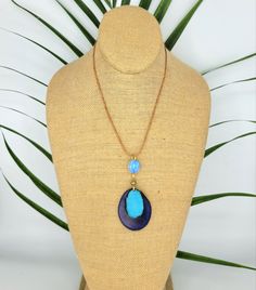 Colorful blue on blue statement pendant. Easy to adjust and clasp free. Artisan made and fun to wear! Adjustable Large Oval Pendant Jewelry, Bohemian Necklace With Large Adjustable Stone, Adjustable Multicolor Jewelry With Large Pendant, Adjustable Necklace With Oval Pendant And Natural Stones, Adjustable Oval Pendant Necklace With Natural Stones, Adjustable Bohemian Resin Jewelry, Adjustable Turquoise Resin Jewelry, Adjustable Teardrop Pendant With Natural Stones, Adjustable Resin Teardrop Jewelry