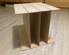 a wooden box sitting on top of a hard wood floor