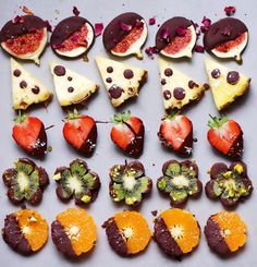 chocolate covered fruit arranged in the shape of pizzas and kiwi's slices