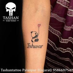 a panda holding a heart shaped balloon with the word tshwar tattooed on it