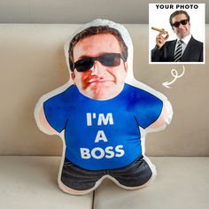 a pillow with a photo of a man in sunglasses and the words i'm a boss printed on it