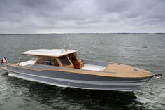 a grey and white boat in the water