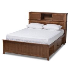 a wooden bed with white sheets and pillows