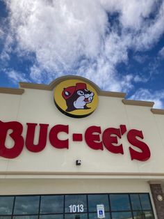 a buc - ee's storefront with the sky and clouds in the background