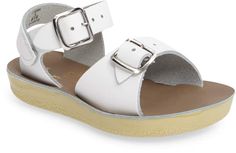 White Closed Toe T-strap Sandals With Buckle, White T-strap Sandals With Buckle Closure For Beach, White Adjustable Slingback Sandals With Buckle Closure, Adjustable White Slingback Sandals With Buckle Closure, Vacation T-strap Closed Toe Sandals With Buckle, Closed Toe T-strap Sandals With Buckle For Vacation, Adjustable White Strap Sandals, Adjustable Ankle Strap Jelly Sandals For Beach, Adjustable Closed Toe Slingback Sandals