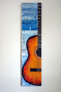 a painting of a guitar hanging on the wall