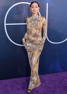 an image of a woman on the purple carpet