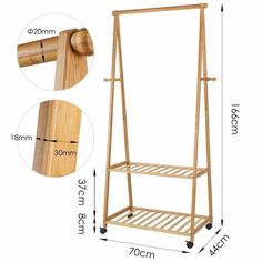 a wooden coat rack with wheels next to it and measurements for the height of the coat hanger