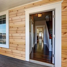 a house with wood siding and white trim