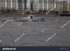 a small boat in the water near some buildings