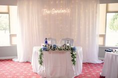 the reception table is decorated with flowers and candles